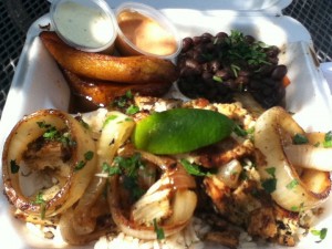 A heaping platter of moist grilled chicken, marinated in lime and garlic, smothered with succulent citrus onions atop a bed of black beans and rice. The Platanos were sweet and tender and the side sauces were ferociously tasty. get both the Mojo and The Bongo Sauce. Que rico!